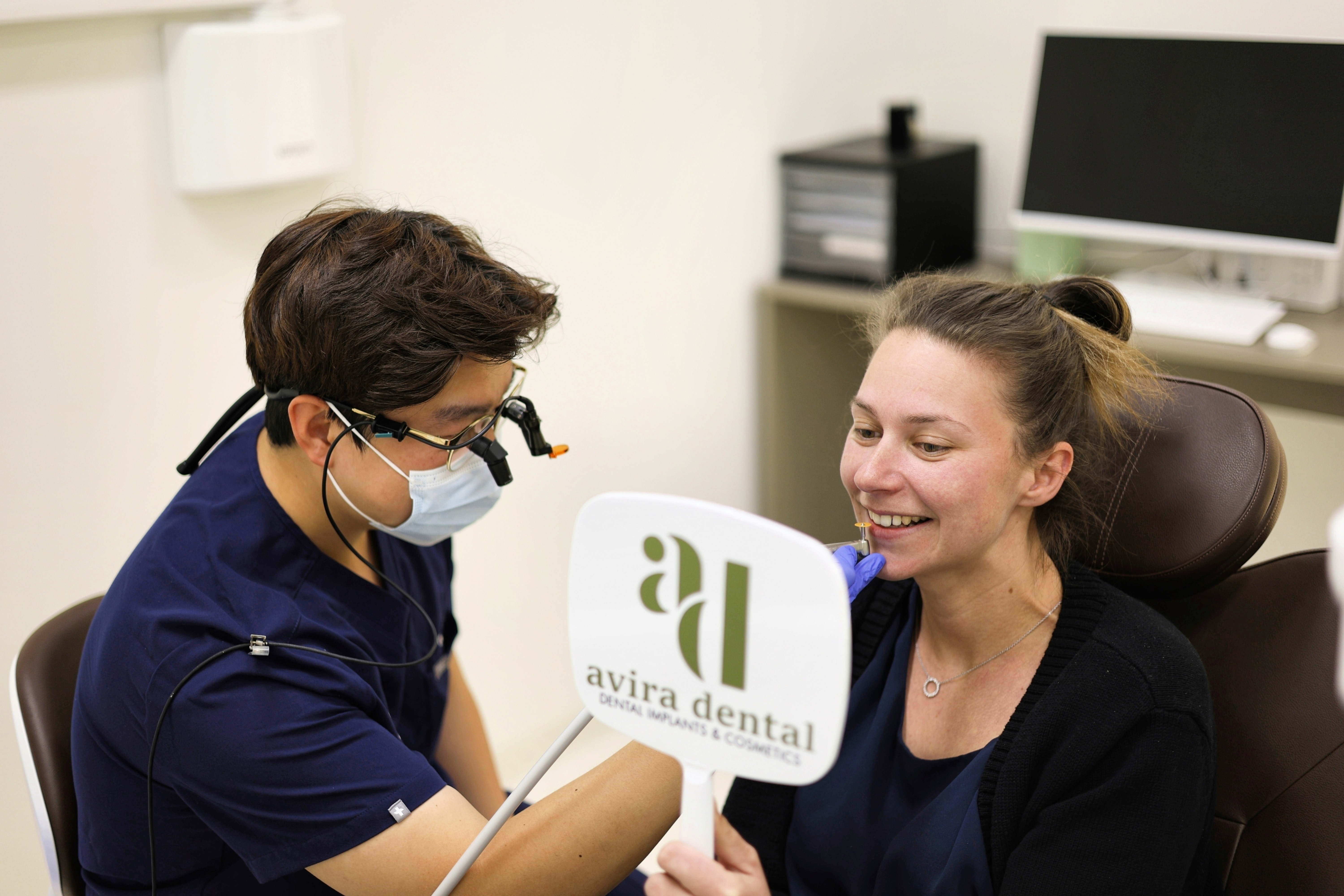 Avira Dental dentist discussing gum contouring and smile design with a patient in Penrith